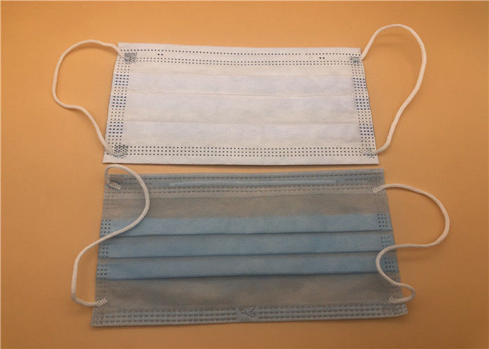 3 eliminabili blu maneggiano la maschera eliminabile medica che respira per la cura personale